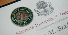 Photo of a Stevens certificate Photo of a student in a lab