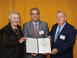 Three people holding up papers together. Link to Life Stage Gift Planner Over Age 70 Situations.