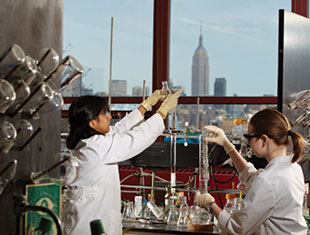 Photo of students working in the lab. Link to Gifts of Life Insurance.