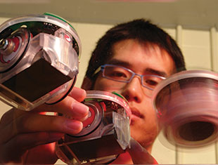 Photo of a student in the robotics lab. Link to Gifts of Cash, Checks, and Credit Cards.